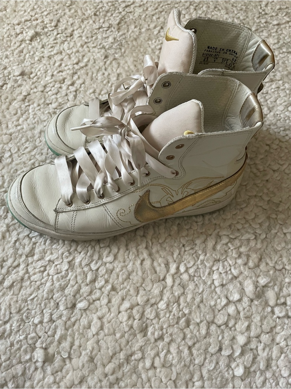 Off White Nike High-Top Sneakers with Gold Accent